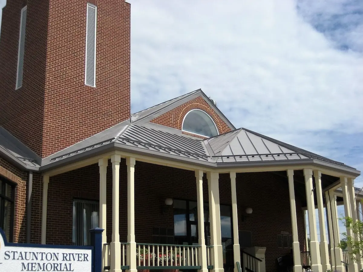 Skilled roofing craftsmen working on a residential roof in Huntington